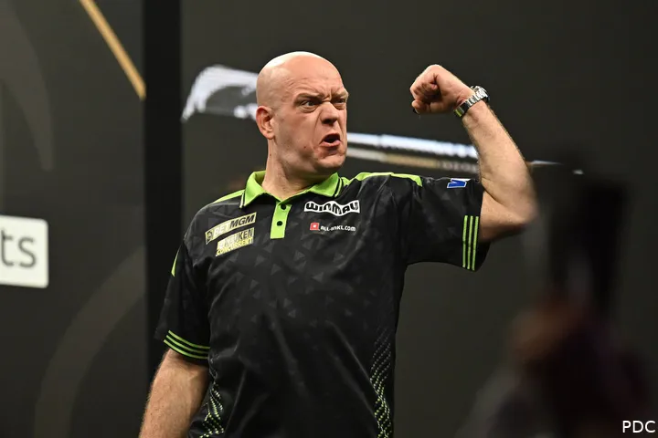 Michael van Gerwen pumps his fist in celebration.