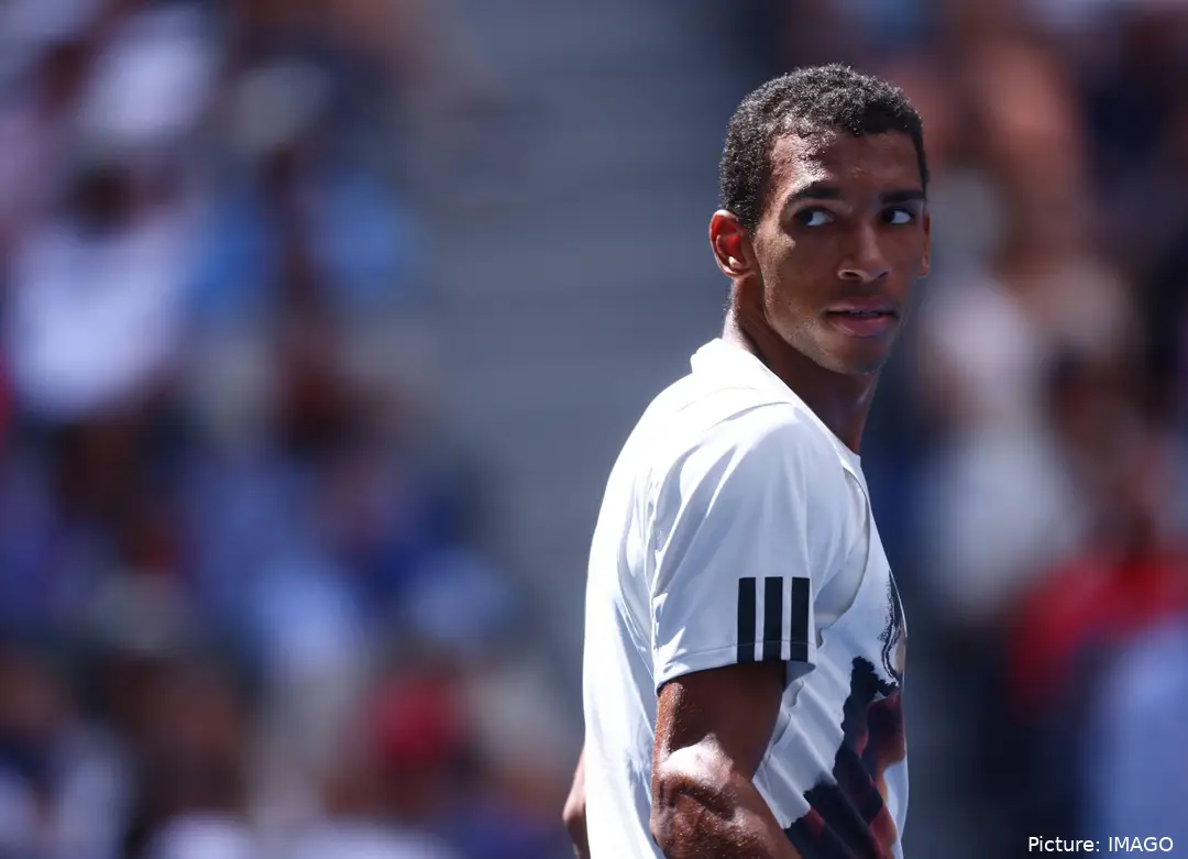 Felix Auger-Aliassime looks over his shoulder