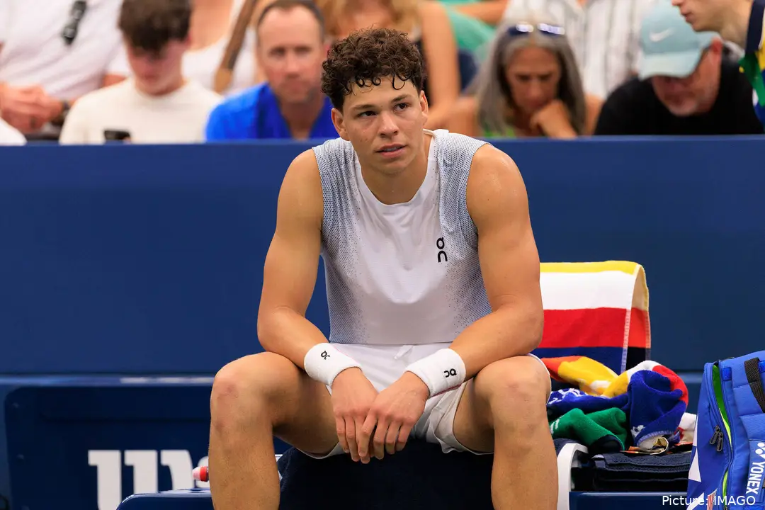 Ben Shelton sits after an injury during the 2025 US Open.