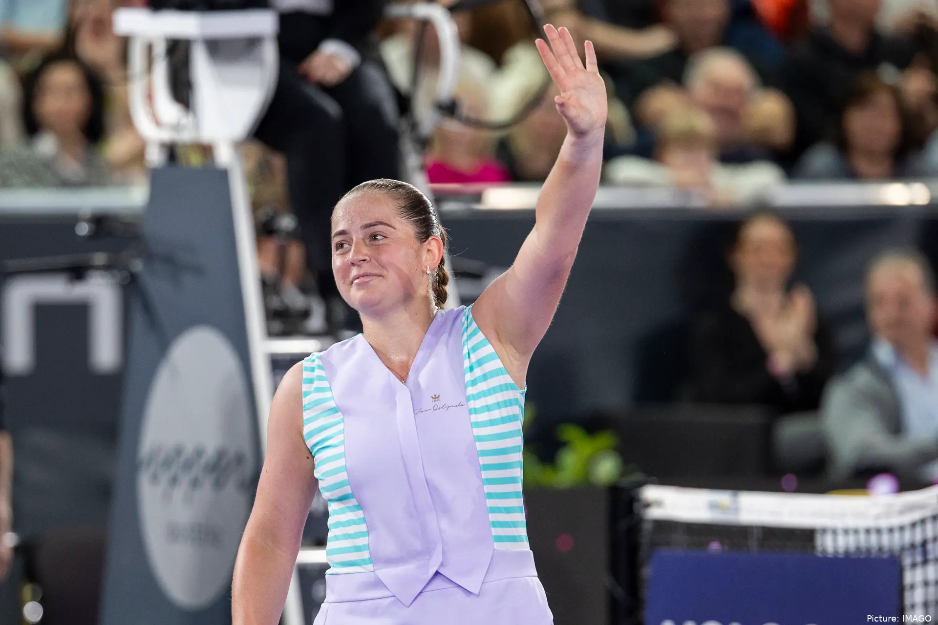 Jelena Ostapenko with her arm in the air