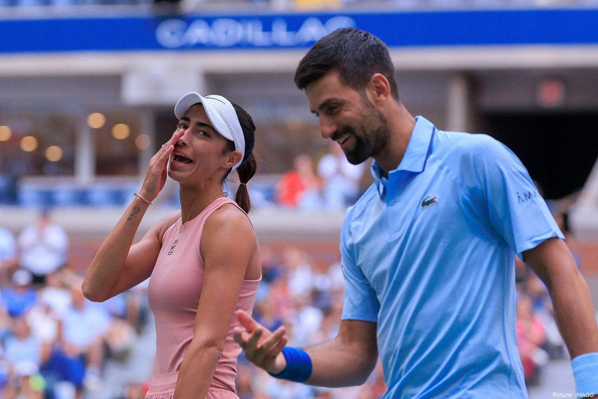 Olga Danilovic and Novak Djokovic smiling together at the 2025 US Open mixed doubles