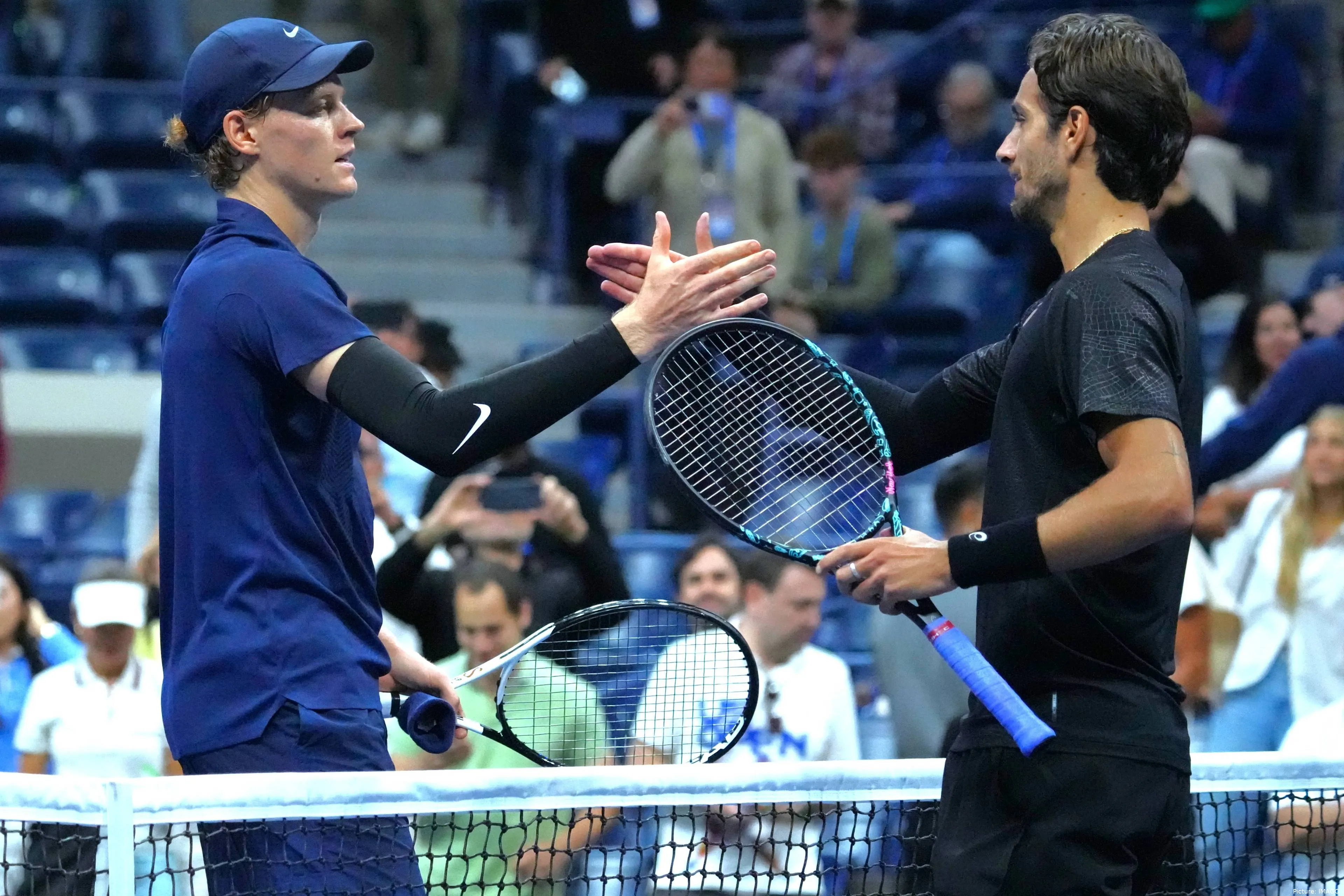 Italian duo Jannik Sinner and Lorenzo Musetti shaking hands after 2025 US Open clash