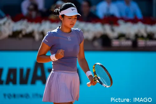 Alexandra Eala fist bumps.