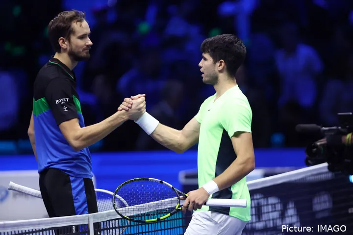 Alcaraz and Medvedev embracing at the net
