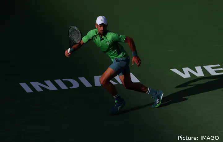 Novak Djokovic prepares to receive the ball on the court at the Indian Wells facilities.
