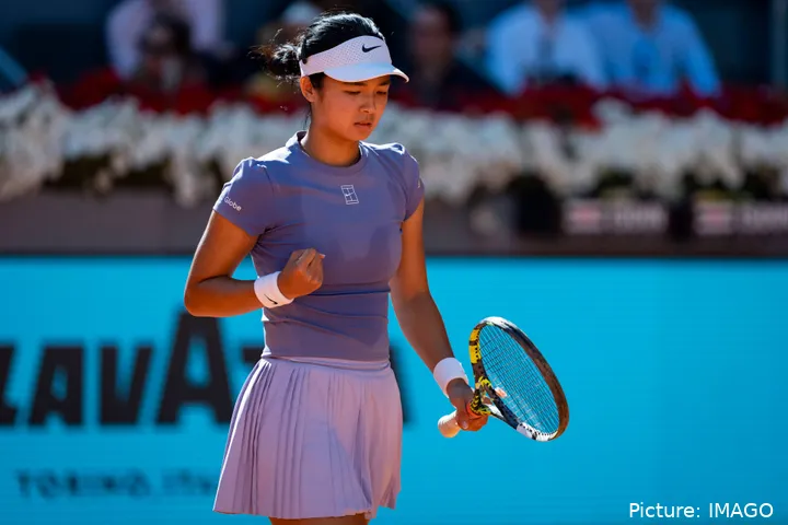Alexandra Eala fist bumps.