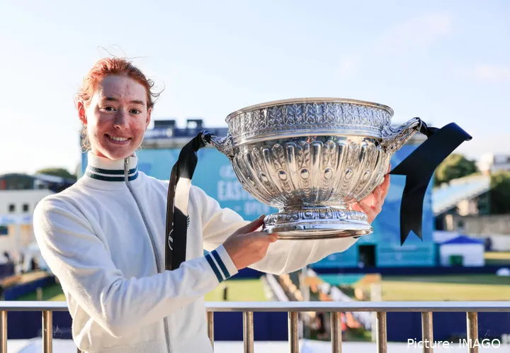 Maya Joing is holding the cup she just won at the Eastbourne Open and she is smiling