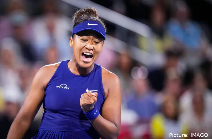 Osaka clenches her fist and shouts, celebrating a victory at the Canadian Open