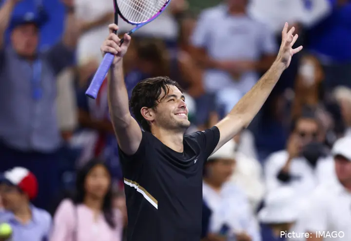 Taylor Fritz lifts arms