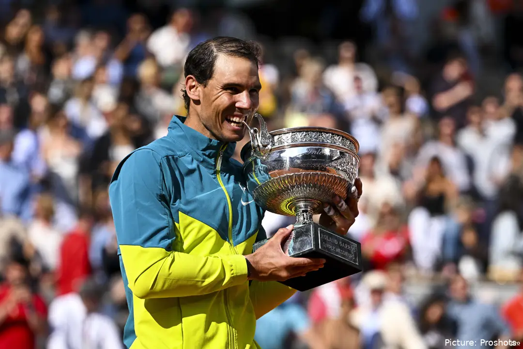 Nadal poses with the 2022 Roland Garros trophy after defeating Ruud in straight sets