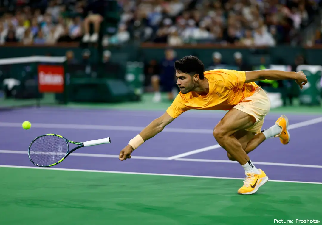 Carlos Alcaraz throwing his racket