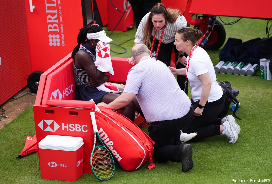 Mboko sitting on the bench receiving treatment for her injury.