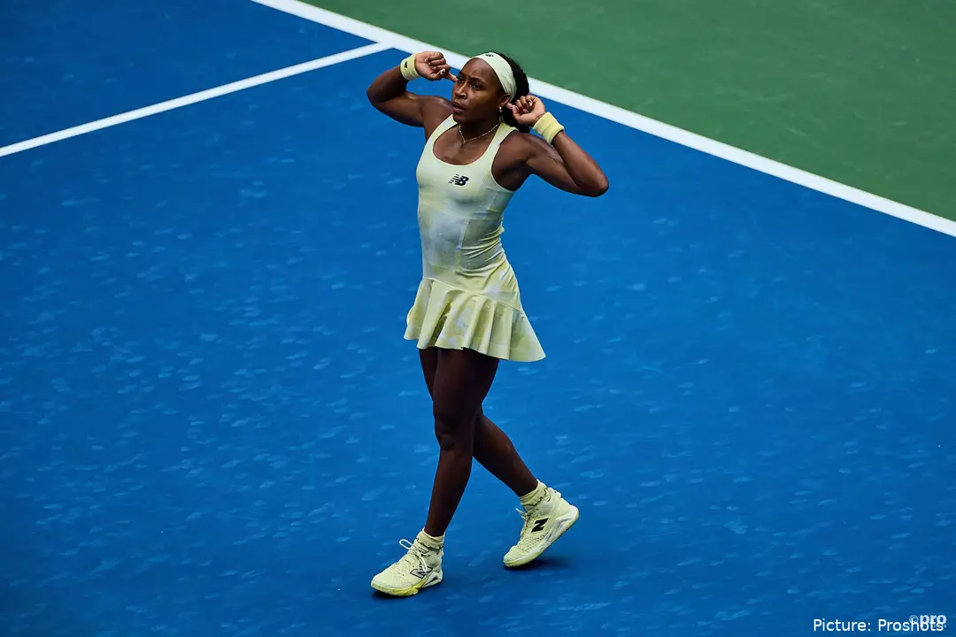 Gauff cups her hands to her ears and gestures to the crowd.