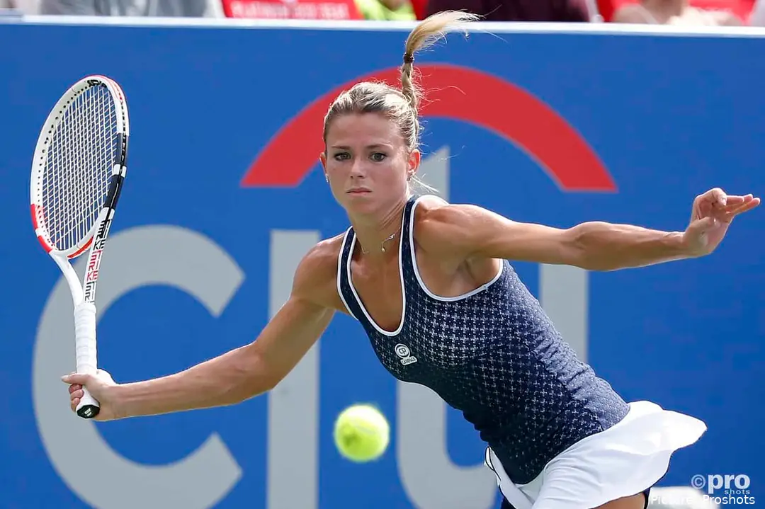 Camila Giorgi returns shot.
