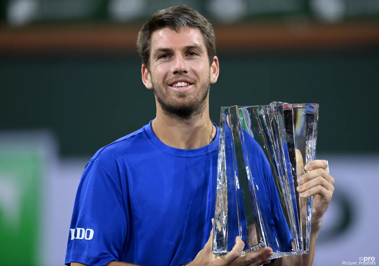 Cameron Norrie with his Indian Wells winner's trophy after a three set victory against Nikoloz Basilashvili