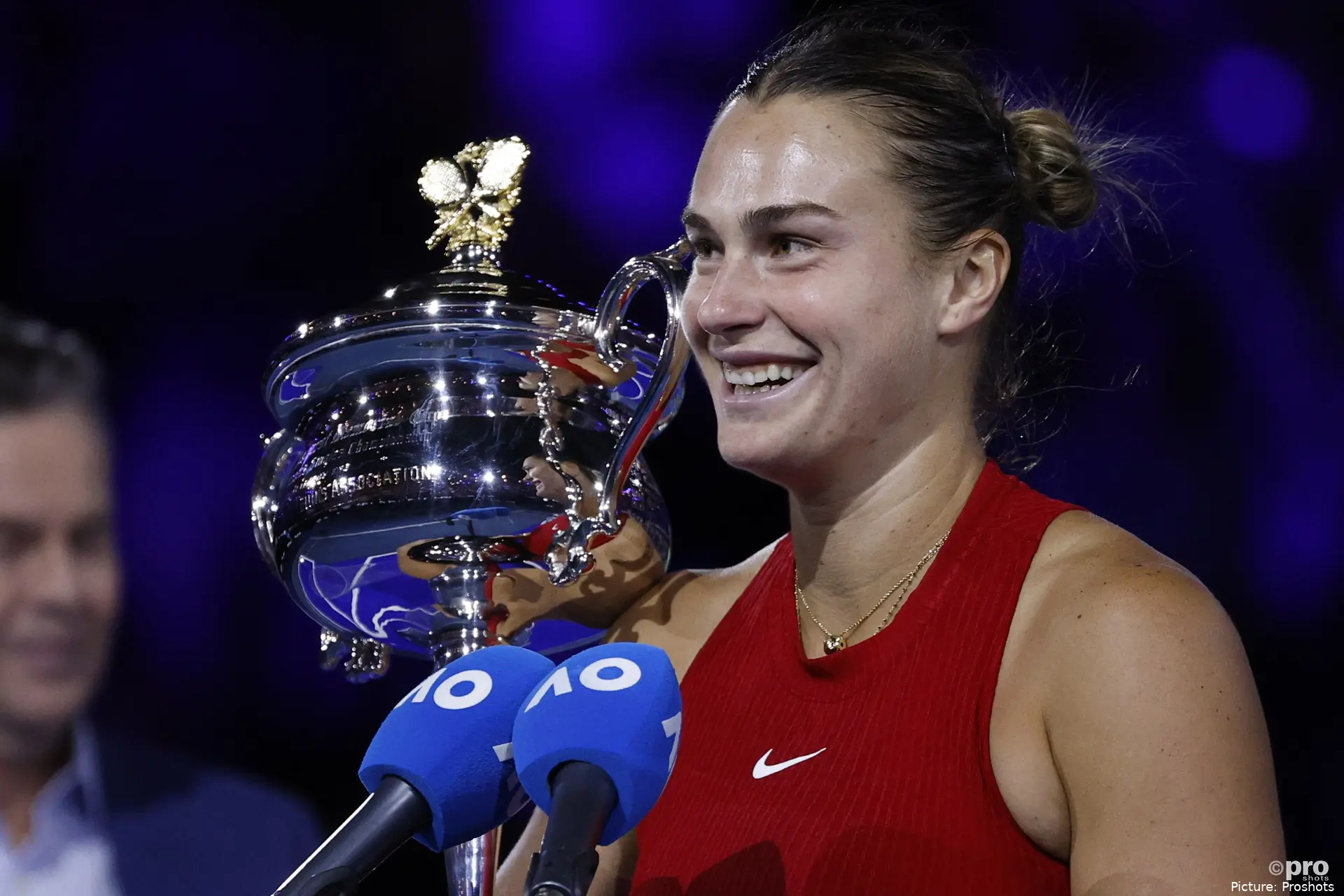 Aryna Sabalenka holding the Australian trophy in 2024