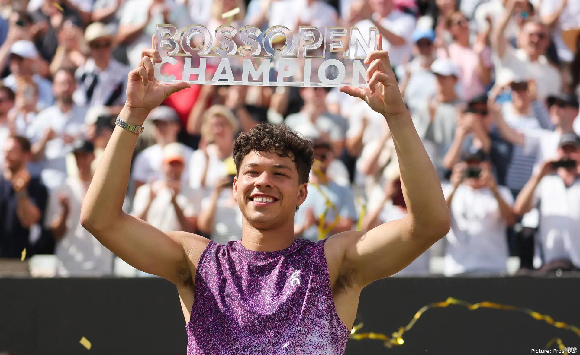 Ben Shelton lifting the Stuttgart Open trophy with a smile on his face