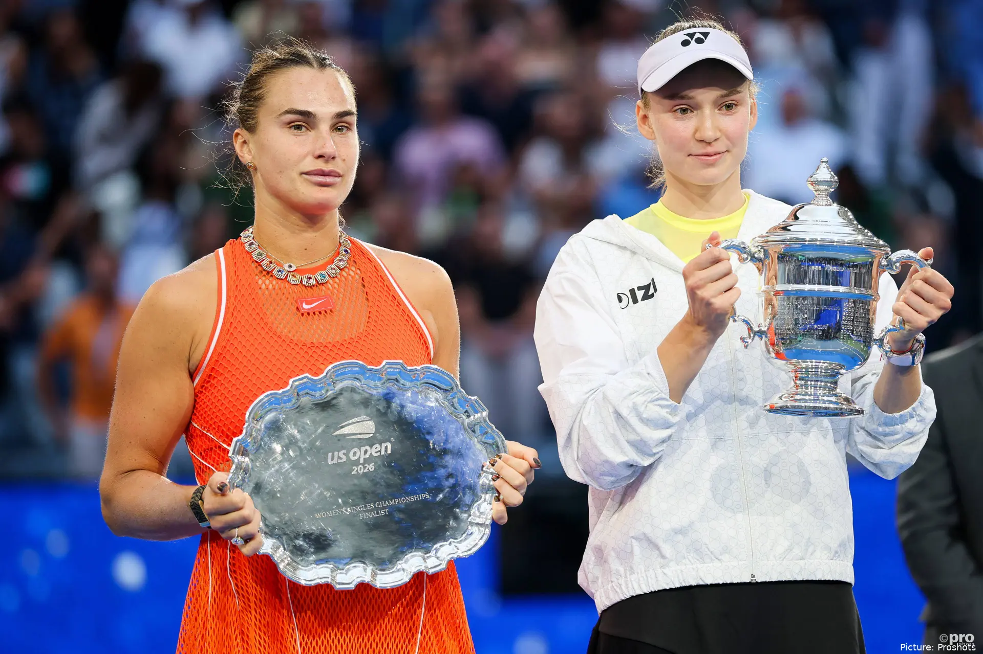 Elena Rybakina and Aryna Sabalenka holding trophies