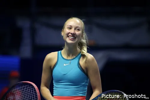 Anastasia Potapova smiling while competing on court