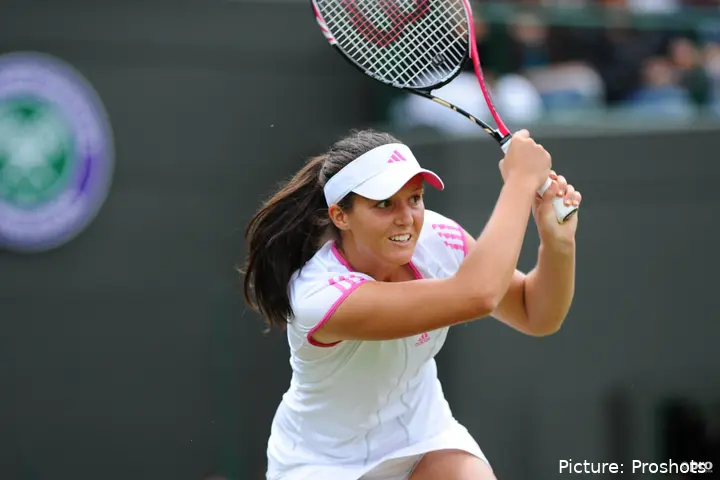 Laura Robson holds her racket above her head after hitting a backhand.