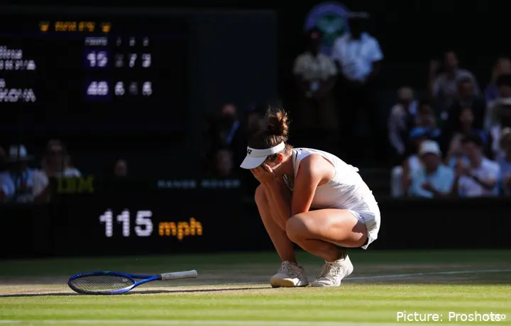 Linda Noskova collapsing to the floor as a Grand Slam champion