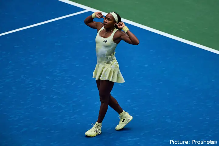 Gauff cups her hands to her ears and gestures to the crowd.
