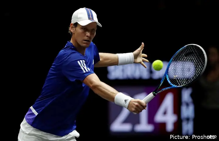 Berdych returns.