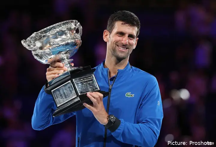 Novak DJokovic holding the trophy at 2019 Australian Open