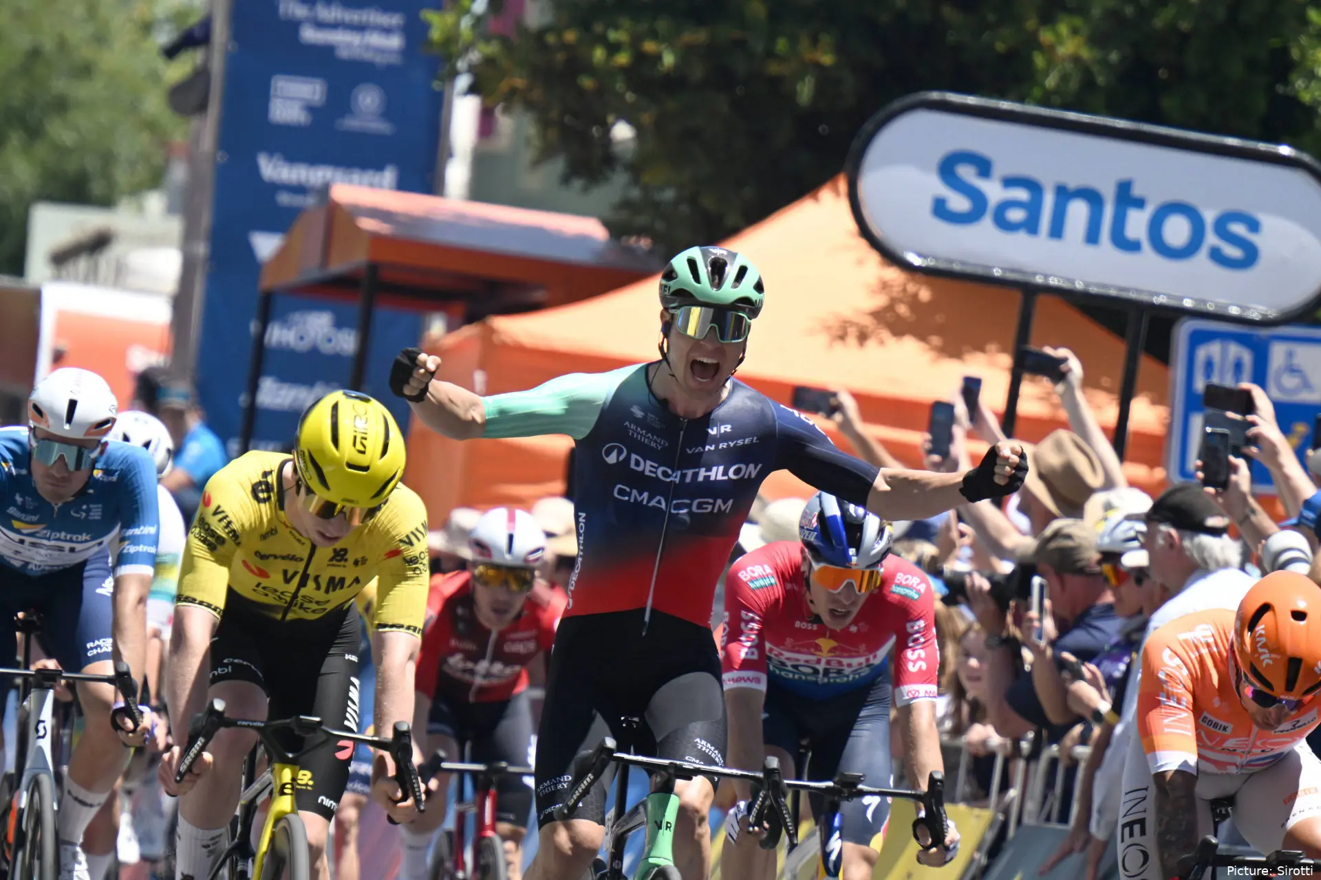 Tobias Lund Andresen raises his arms in celebration after winning stage 1 of the Tour Down Under 2026