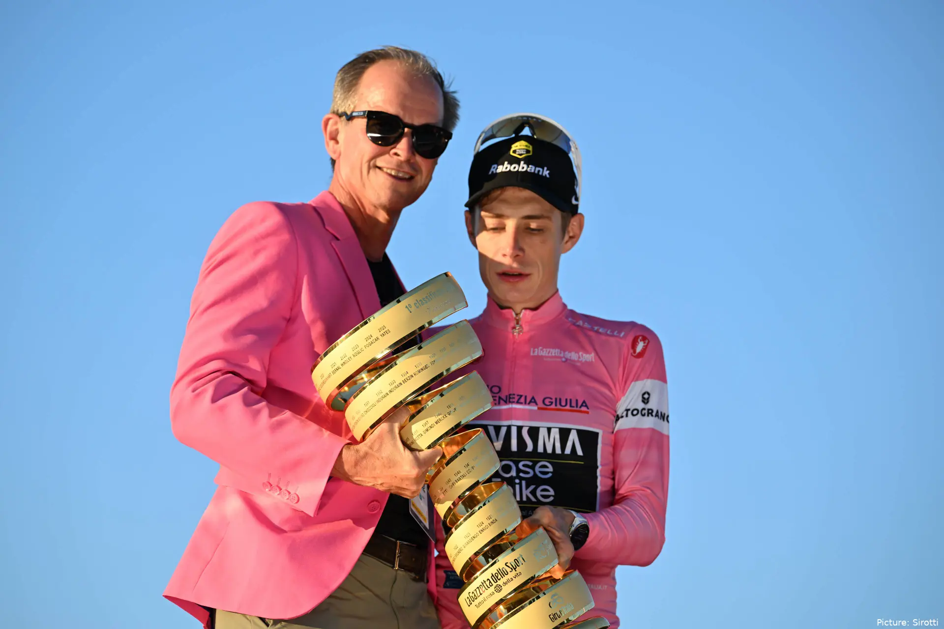 Richard Plugge and Jonas Vingegaard on the final podium of the 2026 Giro d'Italia in Rome