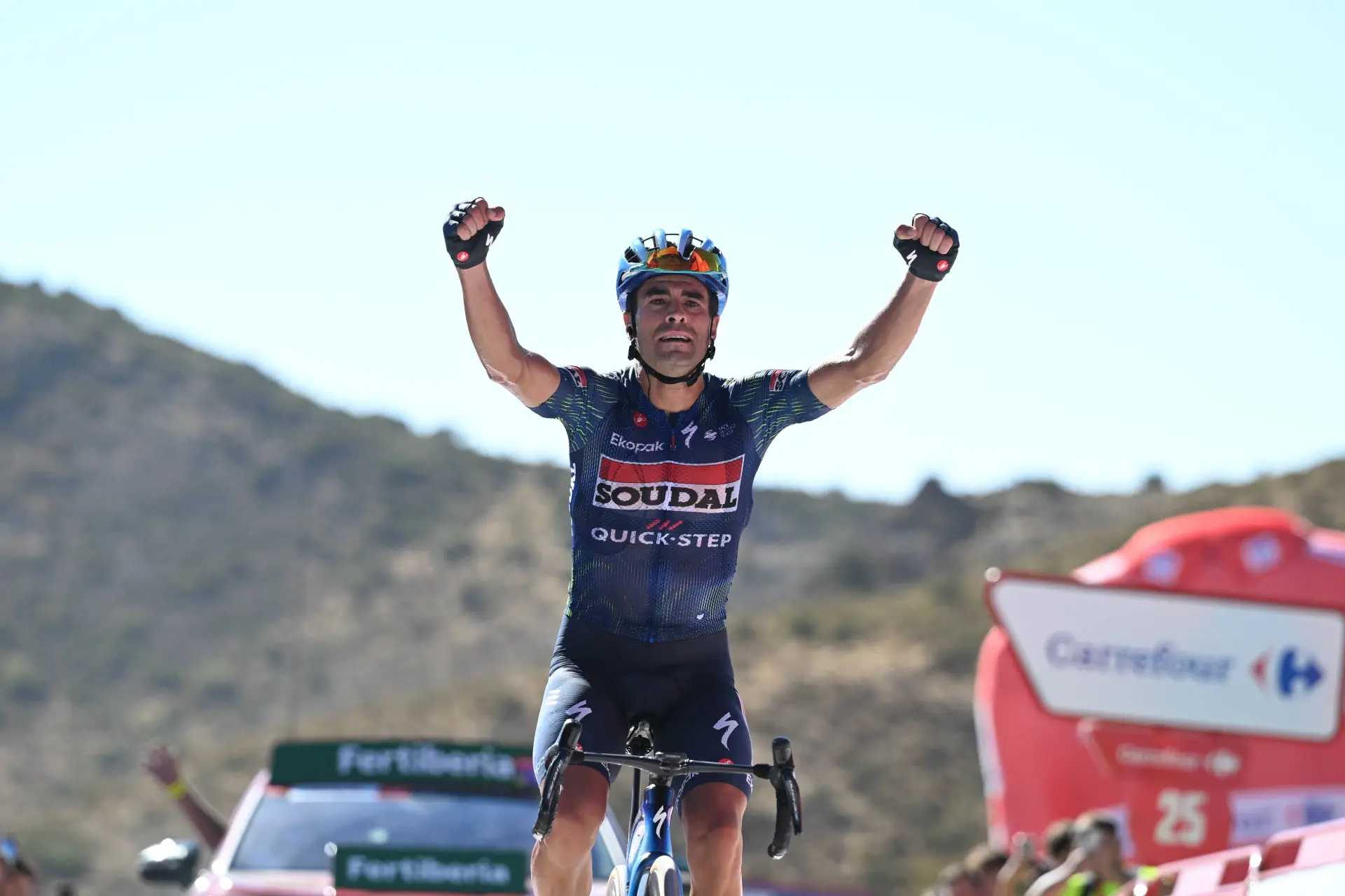 Mikel Landa celebrates as he crosses the line on Stage 20 of the 2026 Vuelta a Espana