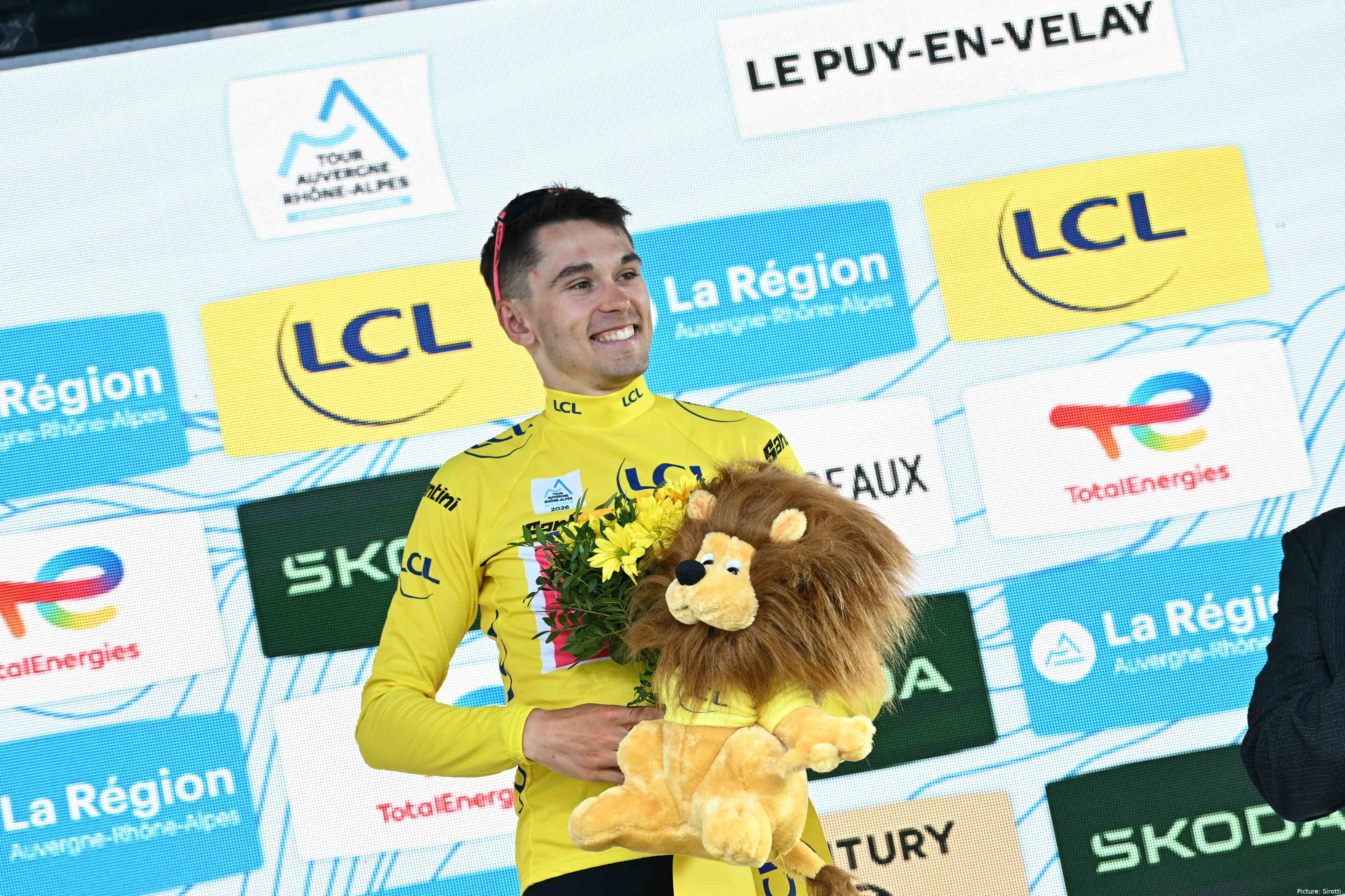 Alex Baudin on the podium in the Maillot Jaune