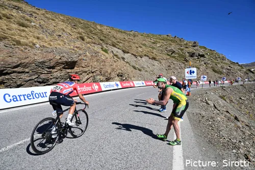 Evenepoel is dropped at the high-altitude summit finish at Sierra Nevada but finishes second week in the lead of the Vuelta a Espana