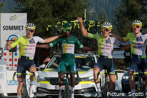 Girmay celebrates his historic Green Jersey win with his teammates