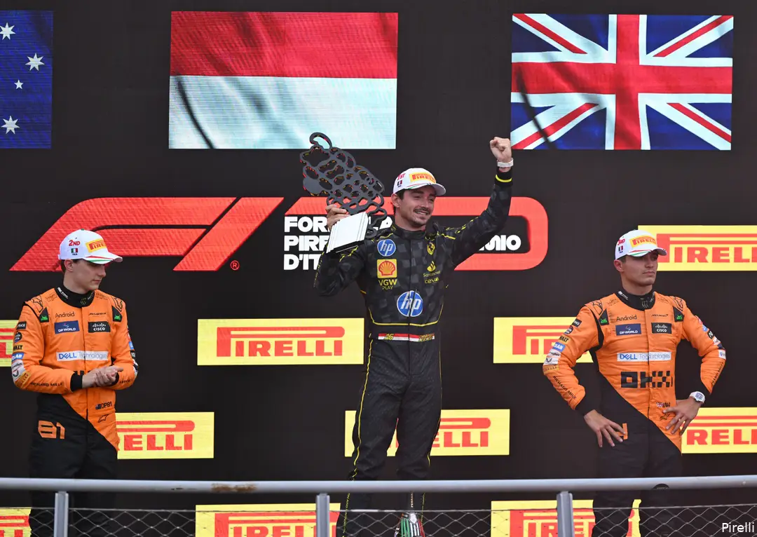 <i>Eén blije Ferrari-coureur, en twee teleurgestelde McLaren-coureurs.</i>