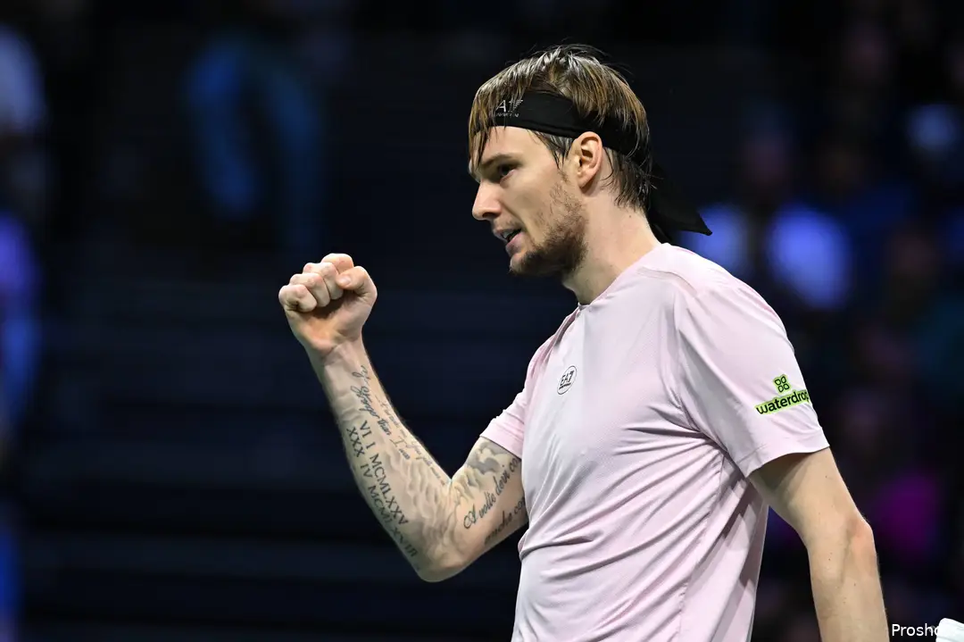 Bublik clenches his right fist as he celebrates at the Paris Masters