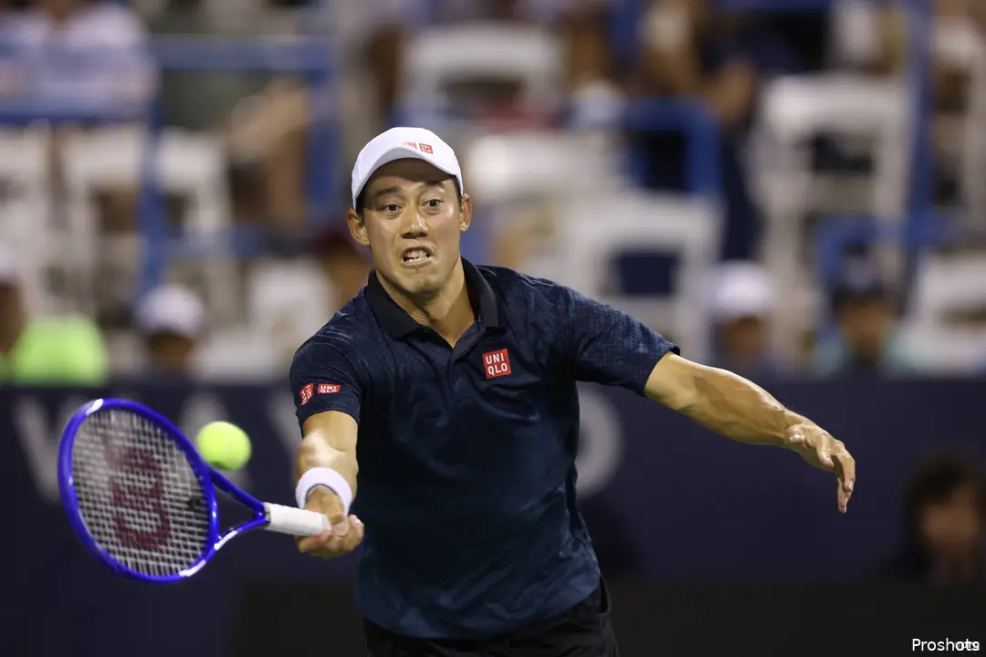 Kei Nishikori reaching for the tennis ball