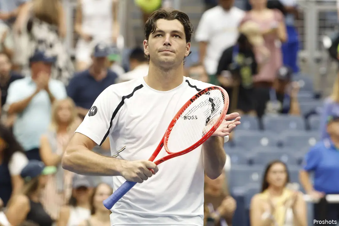 Taylor Fritz clapping with his racket