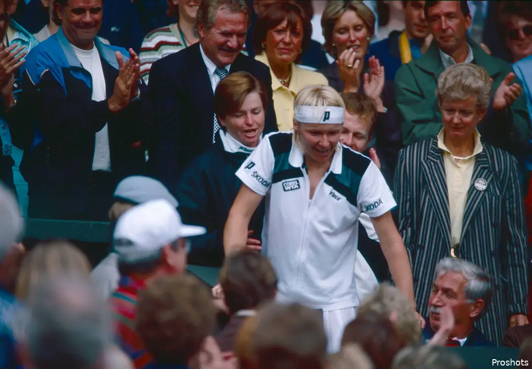 Novotna walks through the crowd.