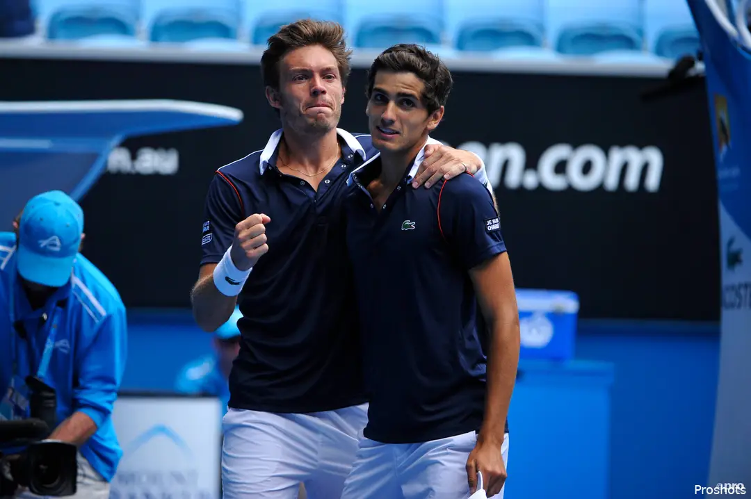 Herbert and Mahut embrace.
