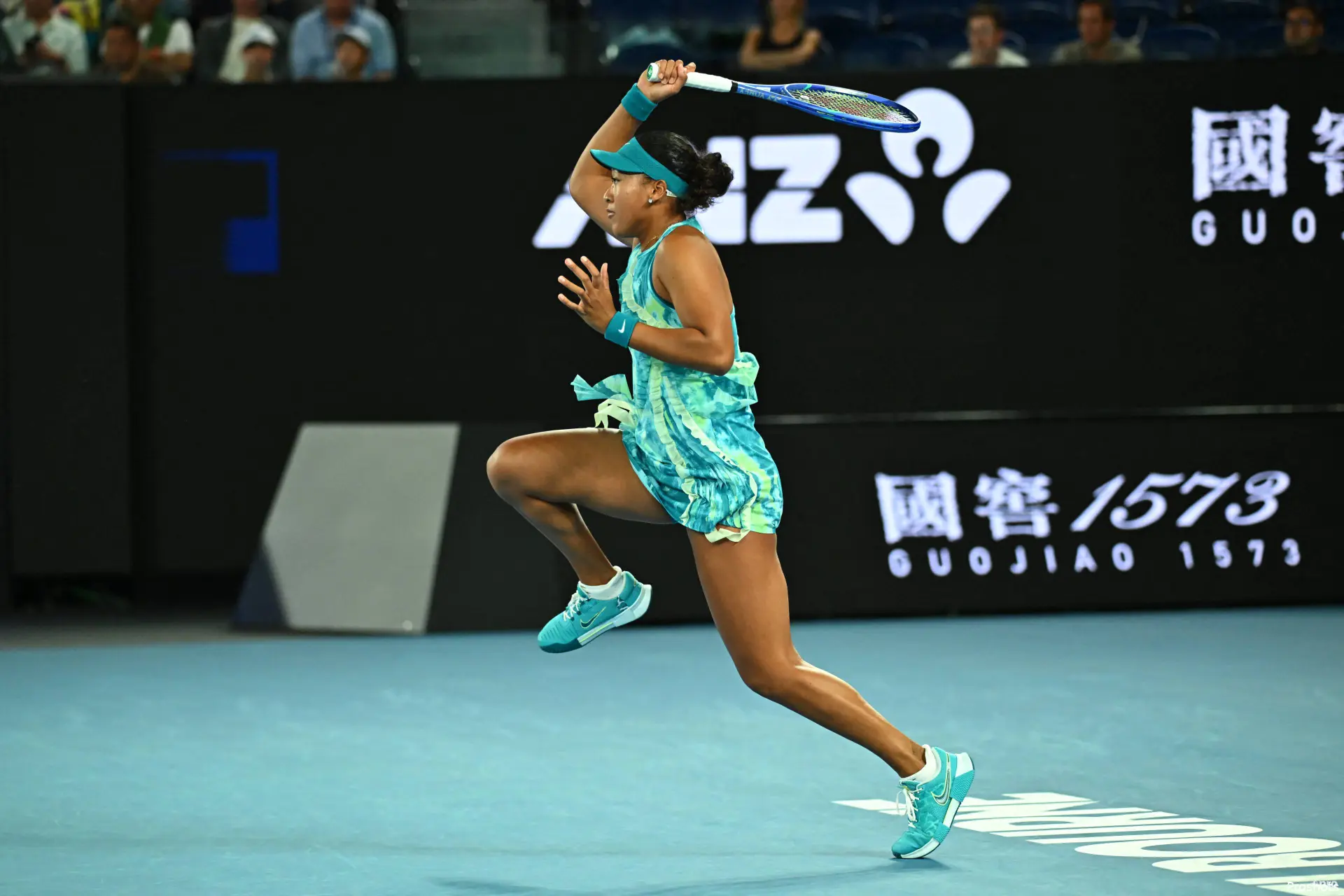 Naomi Osaka hits back a return.