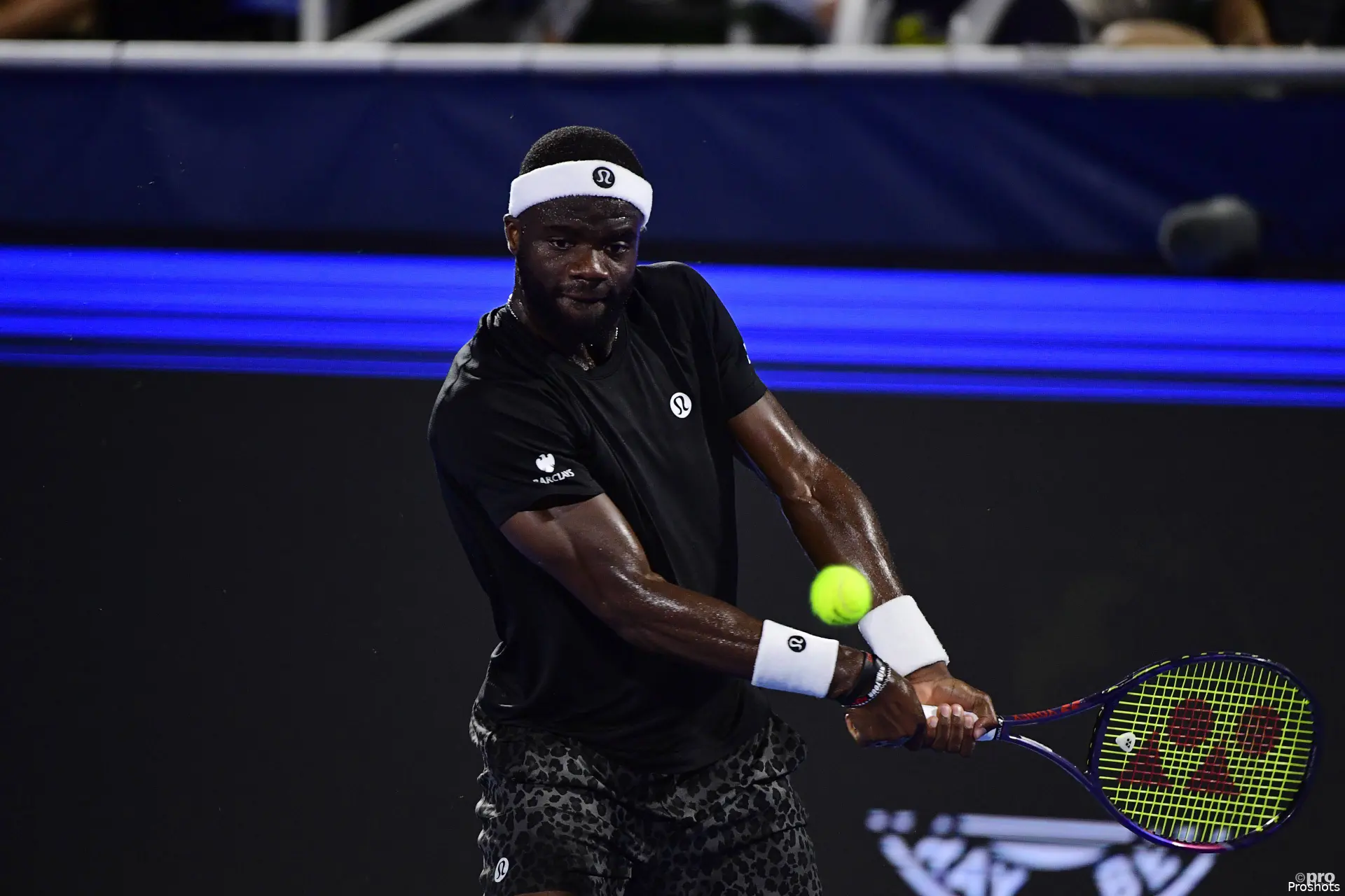 Frances Tiafoe returns on the run.