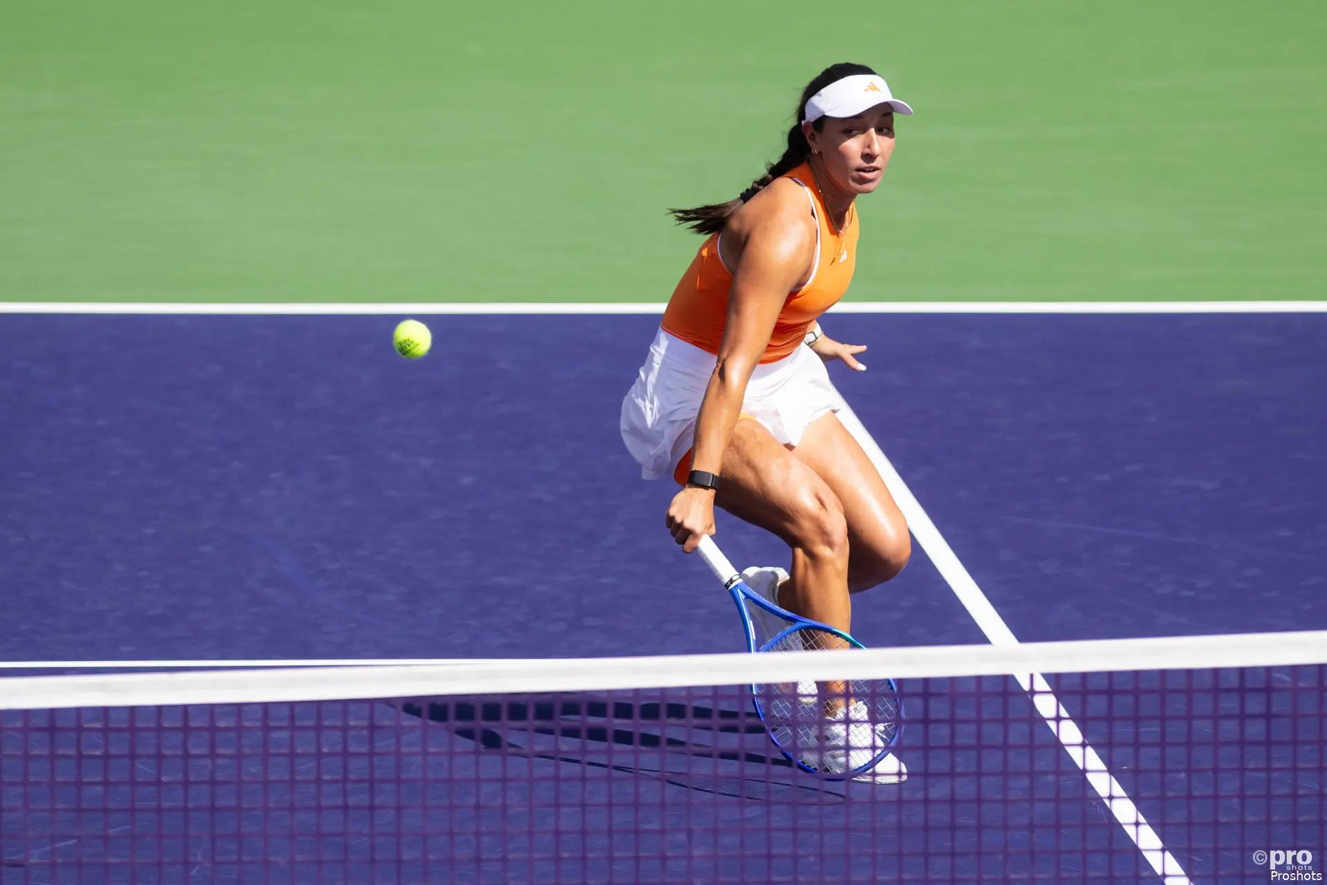 Jessica Pegula returns mid court.