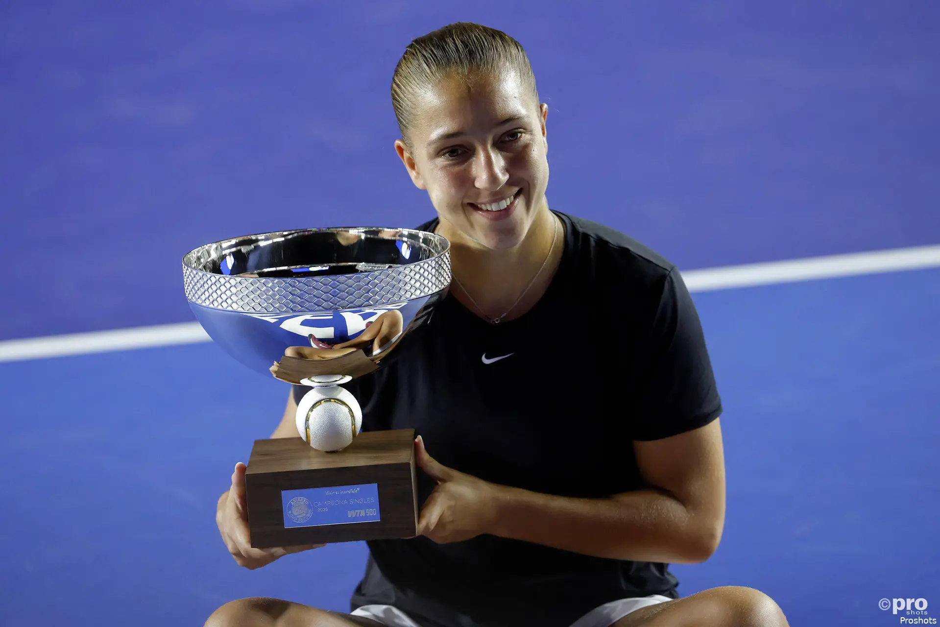 Diane Parry smiling with trophy