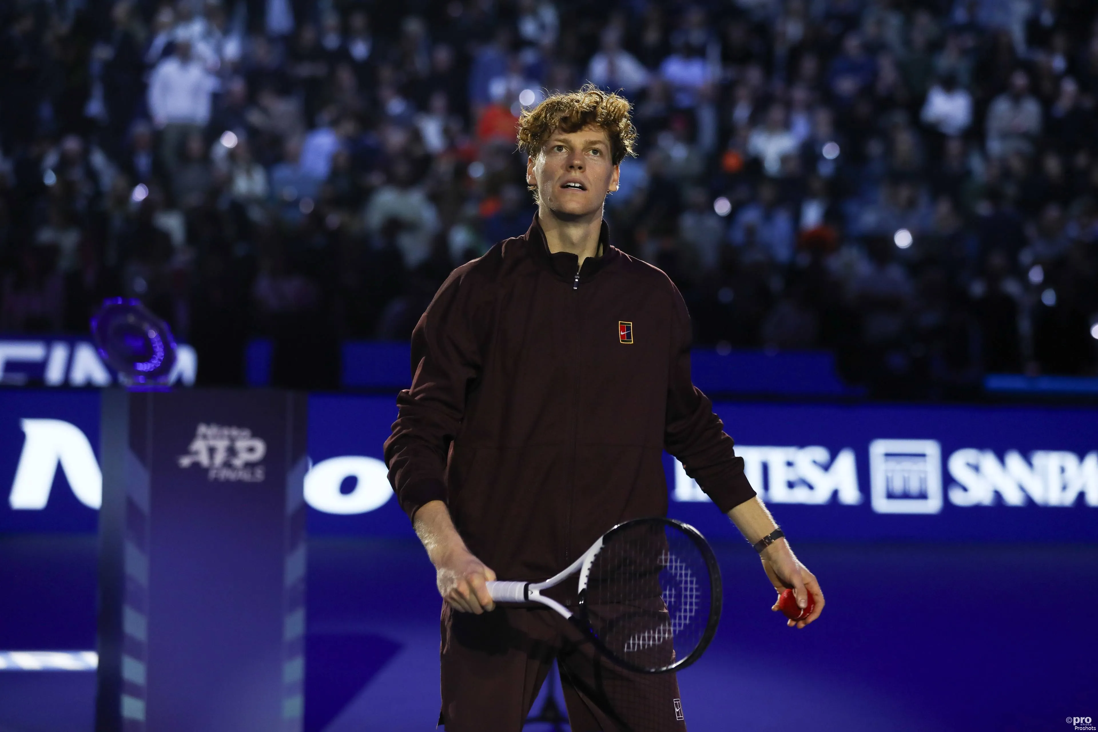 Jannik Sinner holding his racket at the 2025 ATP Finals