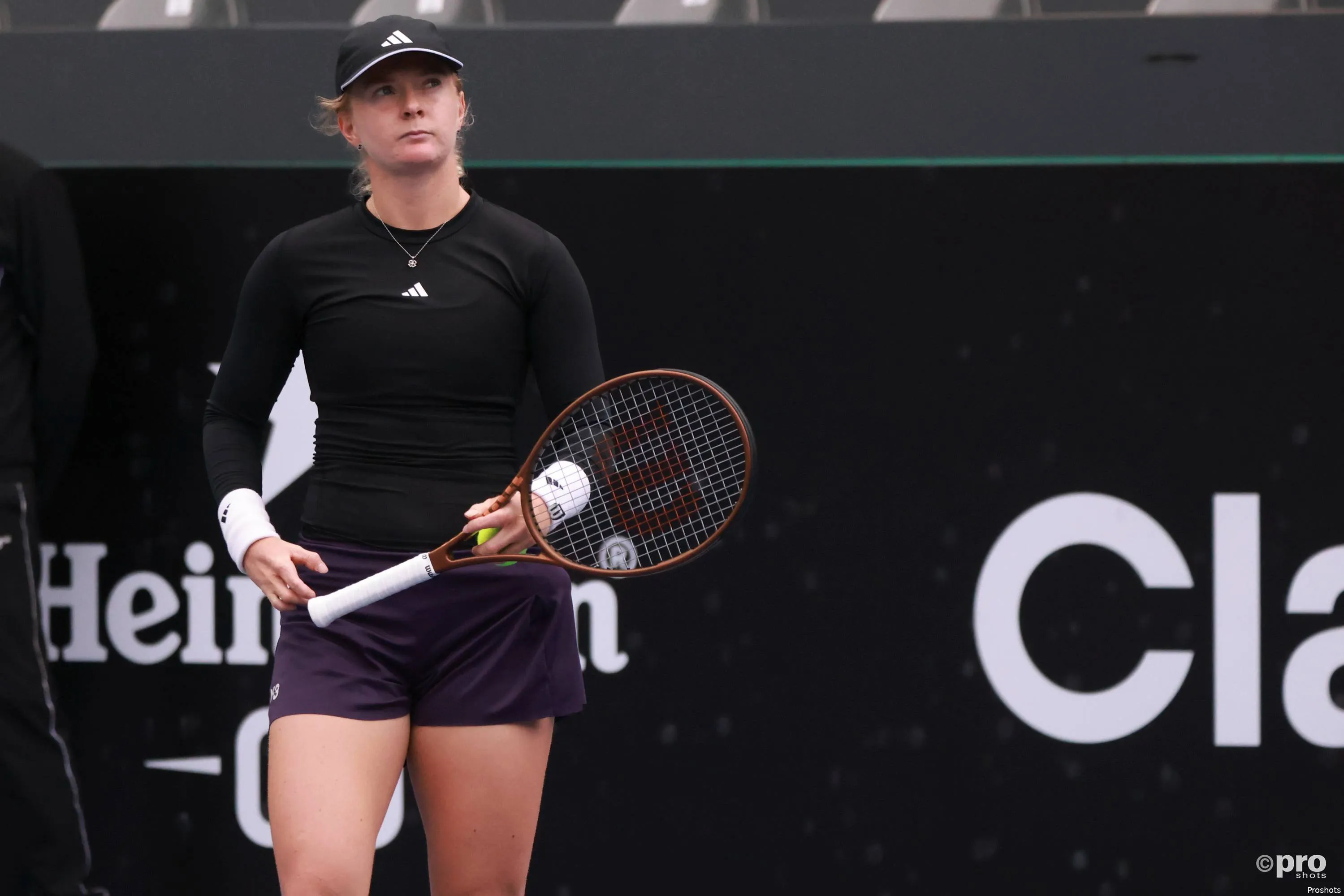 Francesca Jones has racquet in hand.