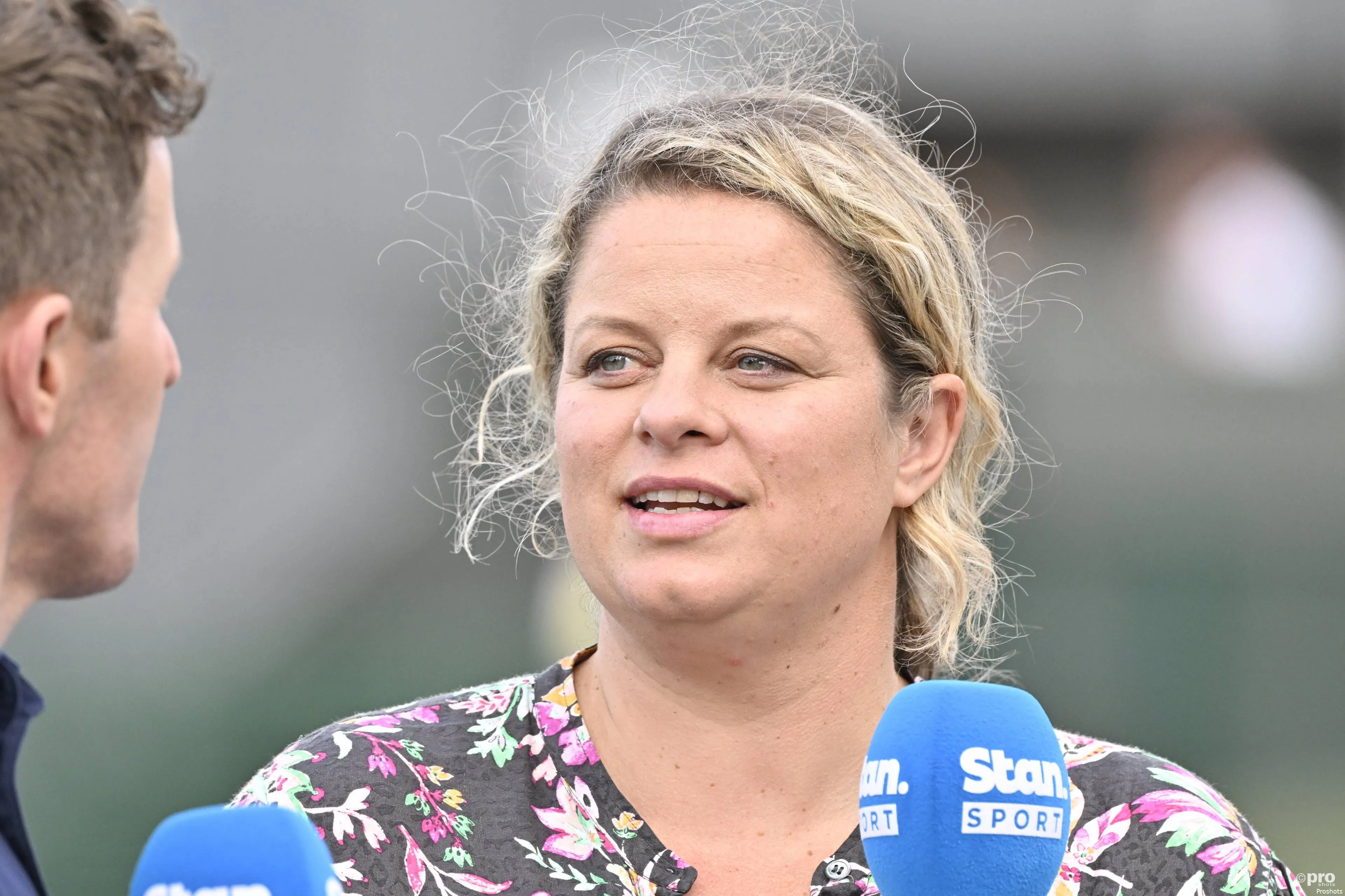 Kim Clijsters with mic in hand.