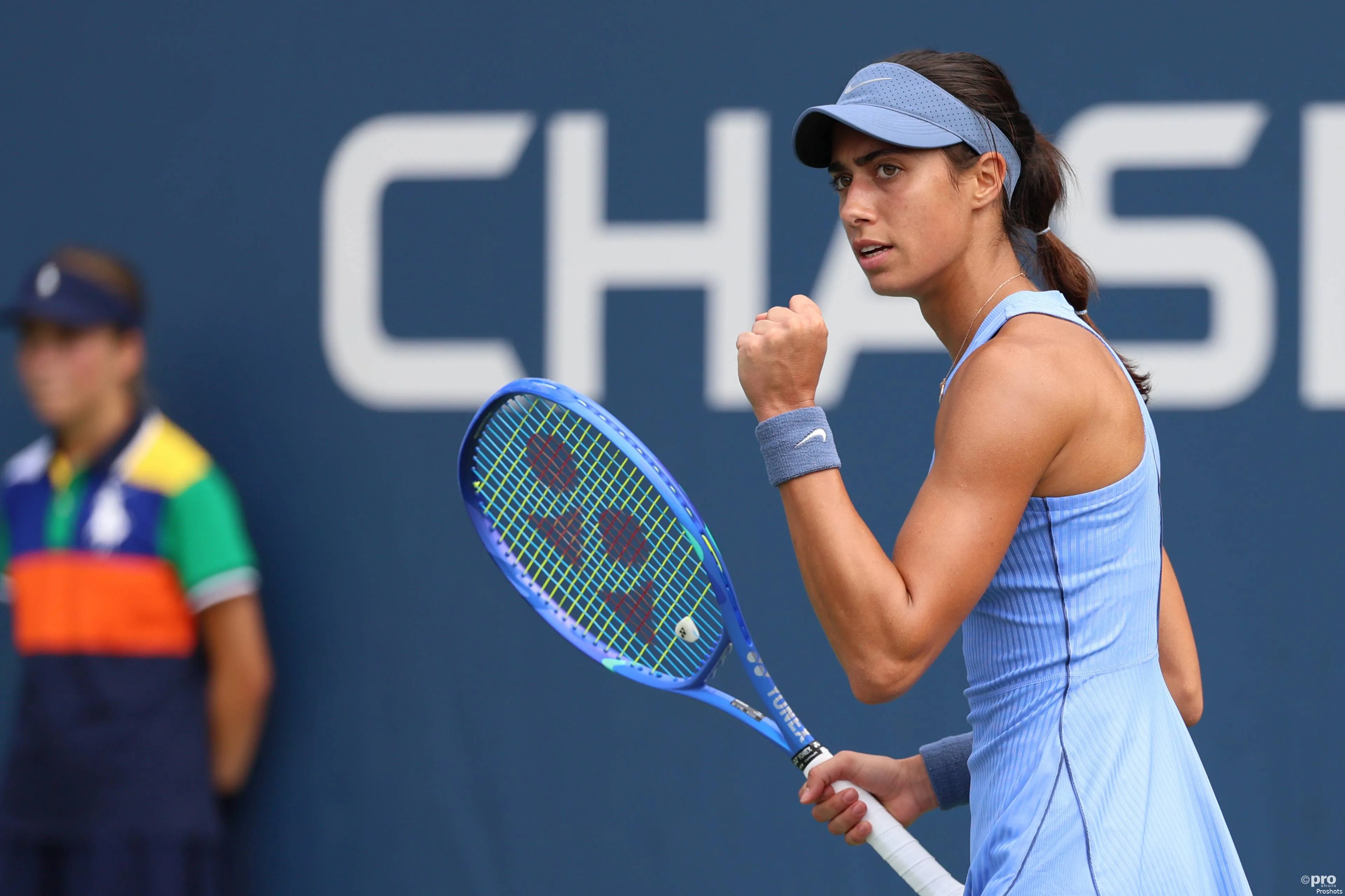 Olga Danilovic fist pumps after winning a point.