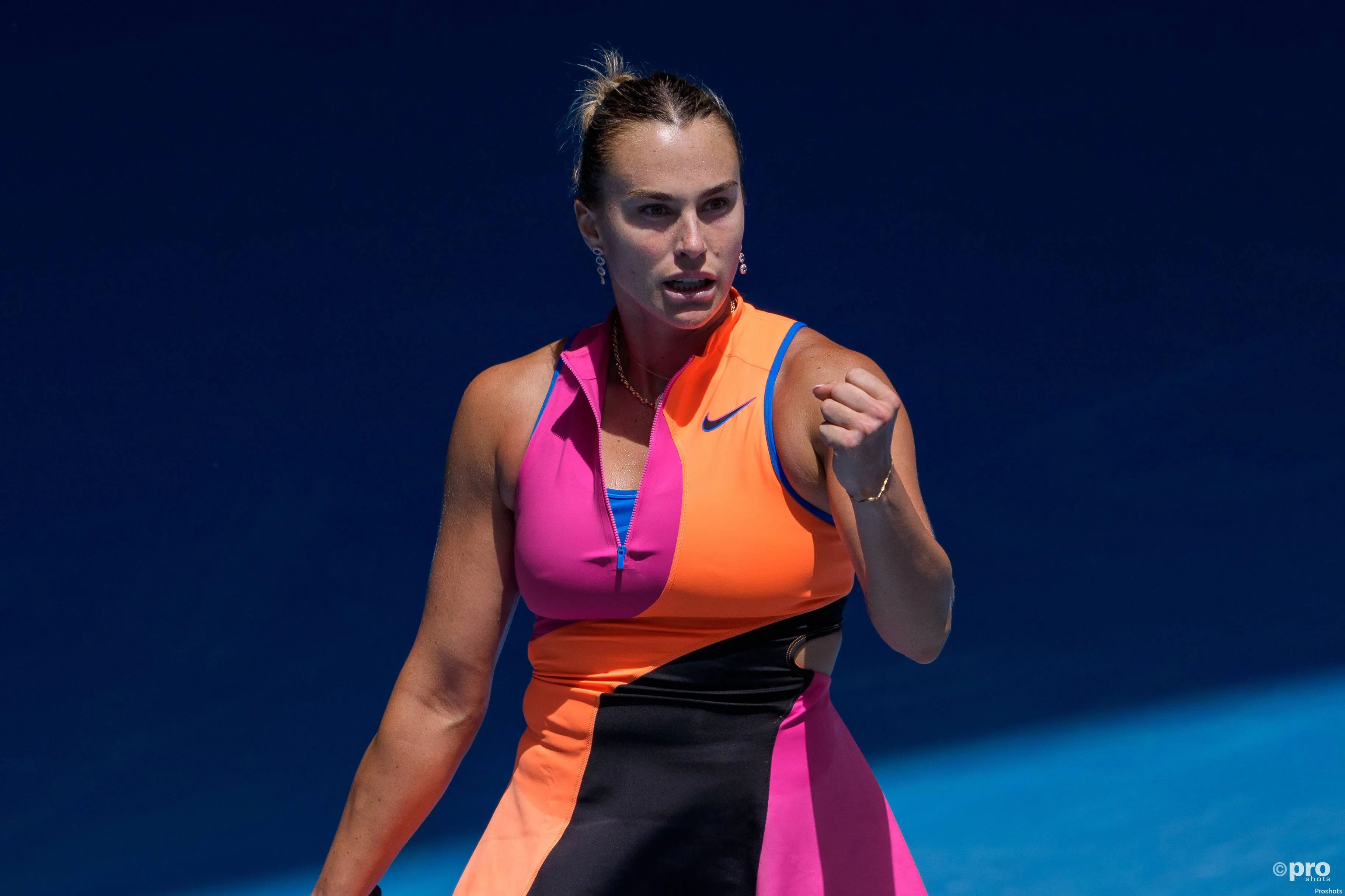Aryna Sabalenka fist pumps during win.