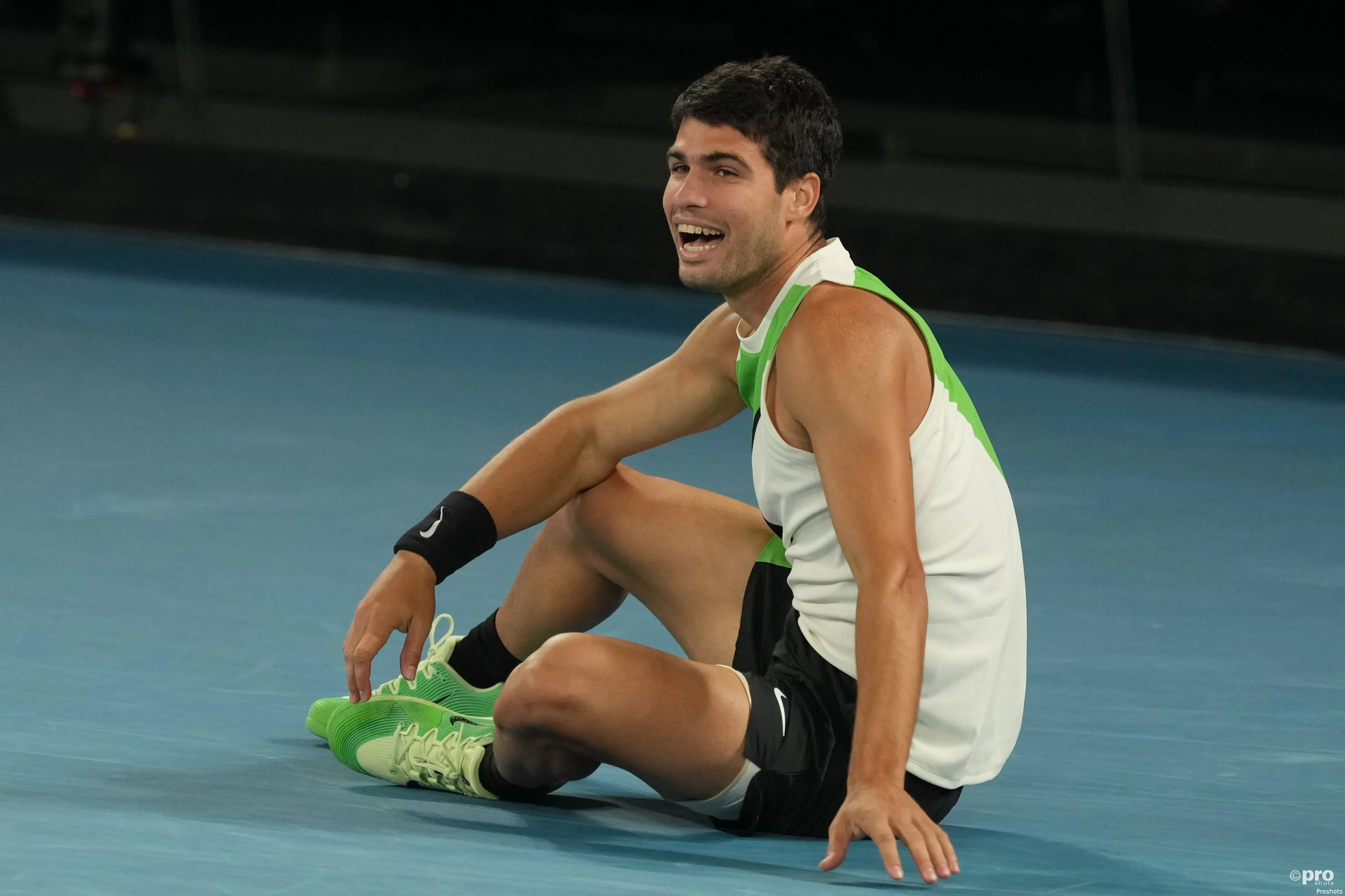 Carlos Alcaraz sat on the ground.